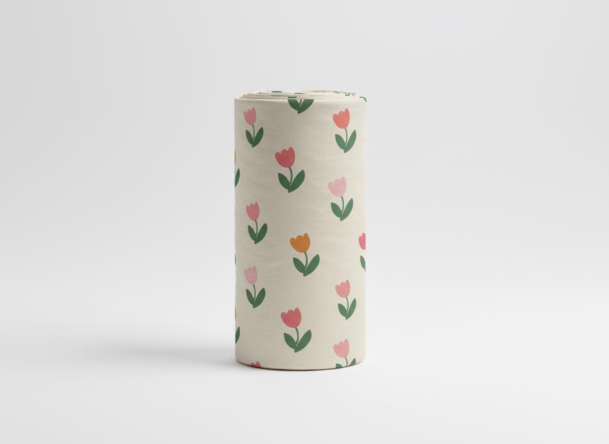 Upright roll of fabric printed with the Spring Tulip pattern of small pink and orange tulips on cream.