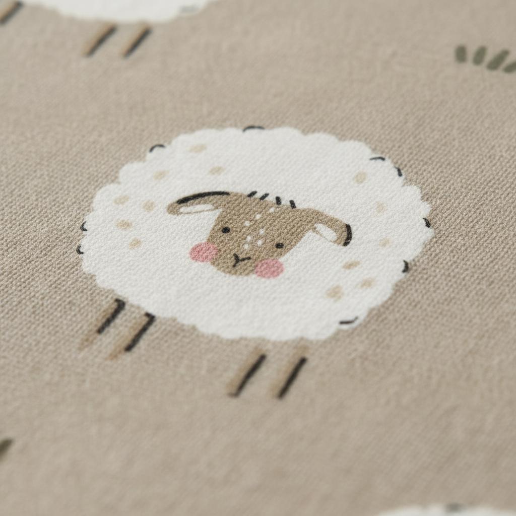A light beige fabric featuring a repeating pattern of stylised sheep. Each sheep has a fluffy white body, a brown face with small dark eyes, and pink circular cheeks. The sheep are depicted with simple brown lines for legs and ears.