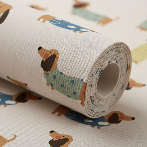 A roll of off-white fabric featuring a repeating pattern of brown dachshunds wearing jumpers. Some dogs wear blue jumpers with white clouds, while others wear light green jumpers with dark blue polka dots, all on a textured surface.