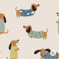 Dachshund seamless pattern: brown sausage dogs wearing striped and spotted jumpers in blue, sage and mustard on a soft beige background.