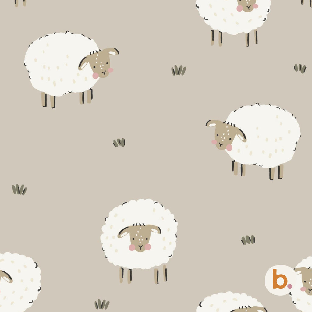 A repeating pattern on a light beige background featuring white fluffy sheep with tan faces, small pink cheeks, and dark brown legs. Small dark brown tufts of grass are scattered between the sheep, and a small logo with the letter b is visible.
