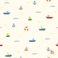A seamless pattern on a cream background featuring small colourful boats, blue anchors, orange life preservers, and wavy lines. The design includes yellow dots scattered throughout, with a small logo in the bottom right corner.