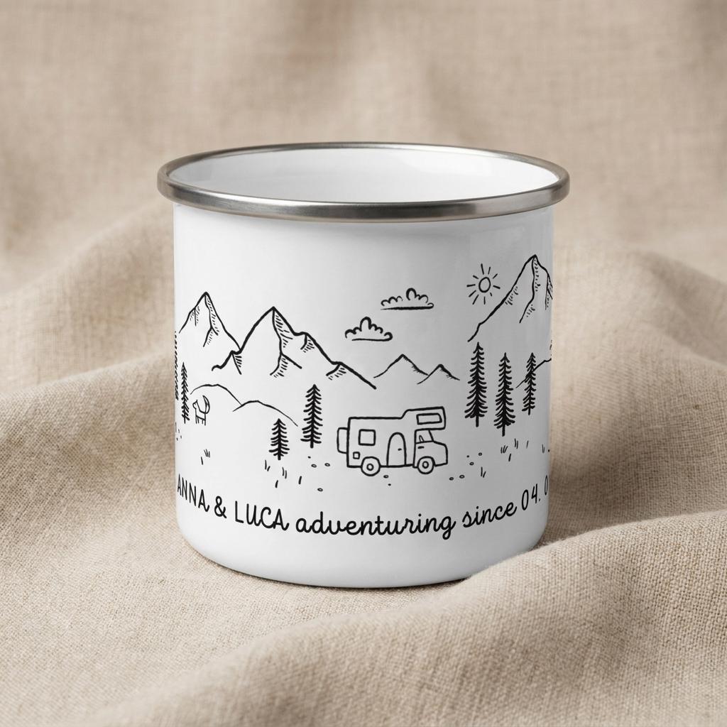 A white enamel mug with a silver rim featuring a black line art illustration of mountains, pine trees, a sun, and a camper van. The text reads ANNA & LUCA adventuring since 04.0