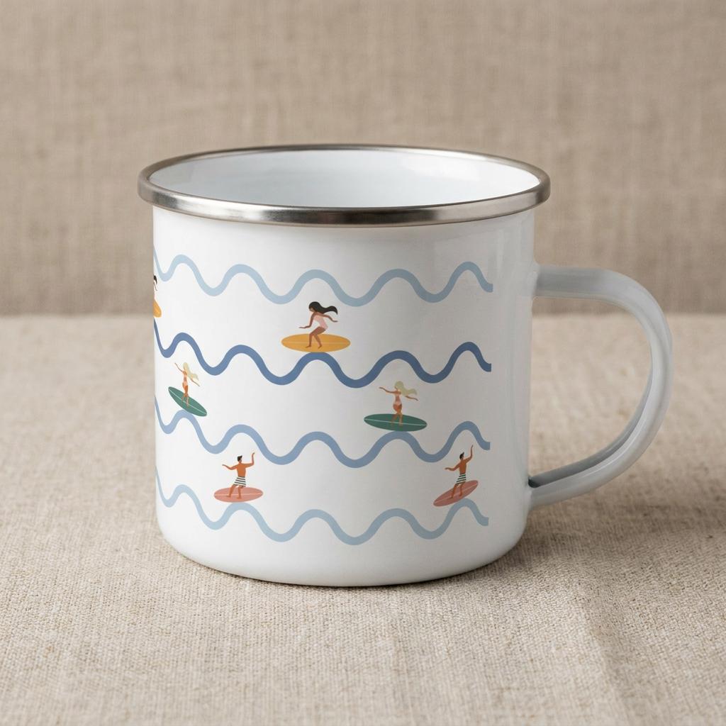 A white enamel mug with a silver-toned rim and handle, featuring a repeating pattern of light blue and dark blue wavy lines interspersed with small illustrations of people surfing on colourful surfboards in various positions.