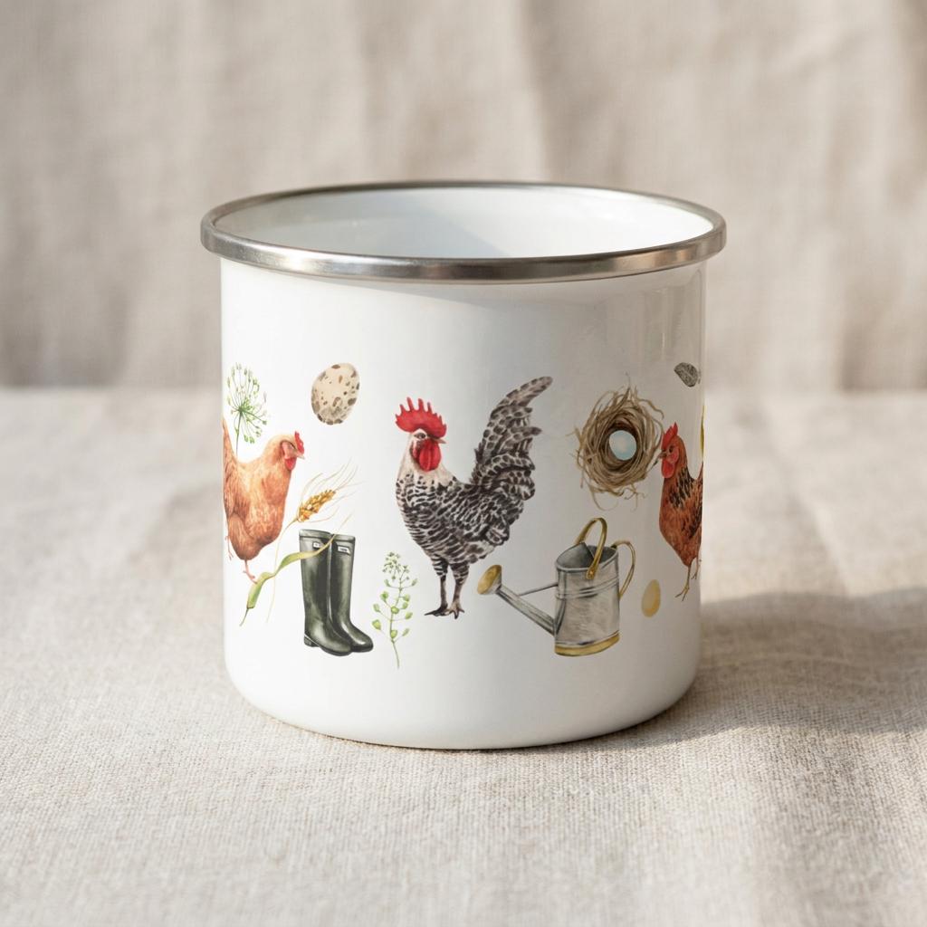 Front view of the Chicken enamel mug showing watercolour hens, a rooster, eggs, a nest, wellies and a watering can, on linen.