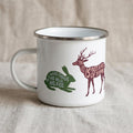 Woodland Animal enamel mug: white camping mug with a green rabbit silhouette reading All good things are wild and free and a burgundy deer reading Getting lost is not a waste of time.