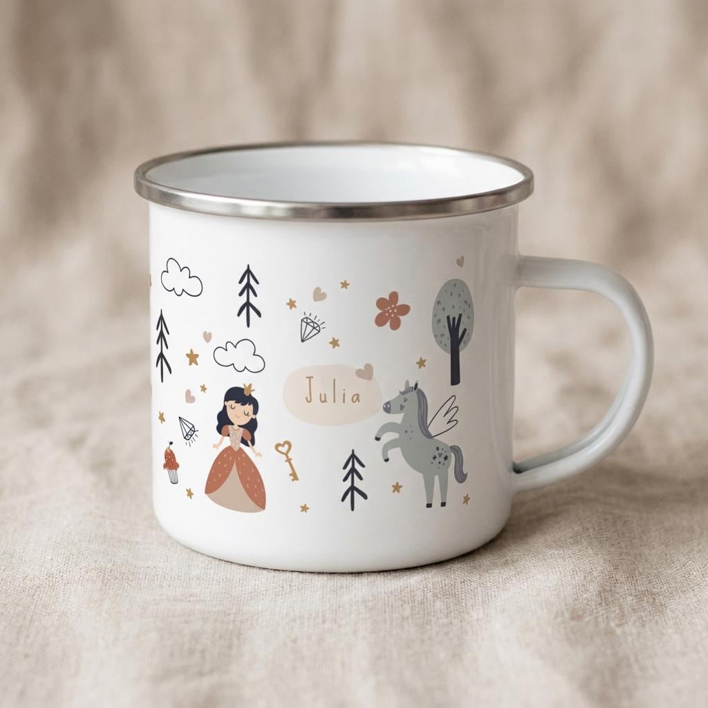 A white enamel mug with a silver rim featuring a printed design of a princess, a winged horse, trees, clouds, stars, and a key. The name Julia is printed in the centre on a light tan oval background, surrounded by small decorative icons.