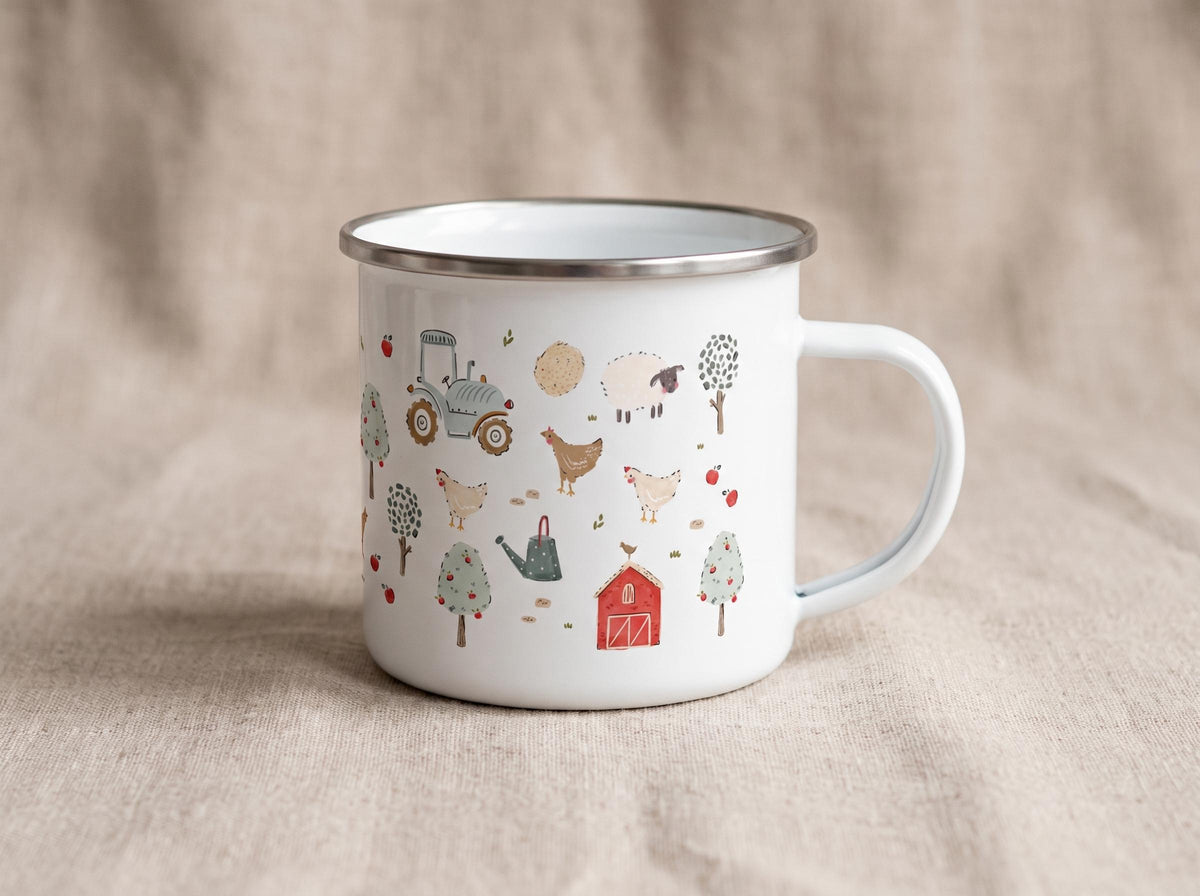 A white enamel mug with a silver-toned rim and a handle, featuring a repeating pattern of farm-themed illustrations including a blue tractor, a red barn, chickens, sheep, trees, apples, and a watering can in muted earth tones.