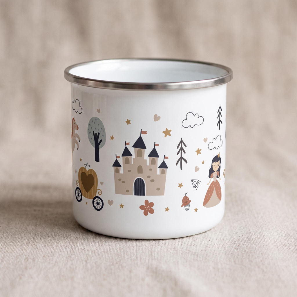 A white enamel mug with a silver-toned rim featuring a repeating pattern of brown castles, a horse-drawn carriage, a princess figure, trees, clouds, stars, and hearts in muted earth tones printed around the exterior surface.
