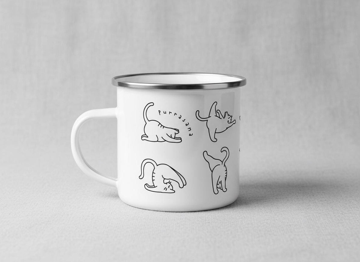 Side view of the white enamel camping mug showing line drawings of stretching cats and the text Purrasana.