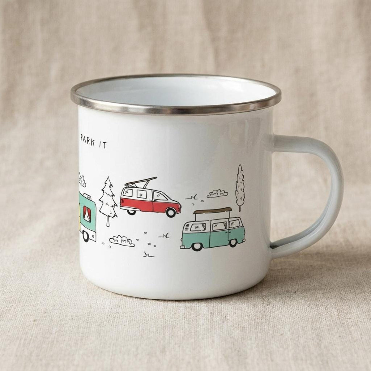 Right side view of the white enamel camping mug showing the handle and illustrations of a teal campervan and red campervan.