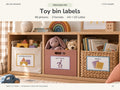 Little Homes printable toy labels on a warm oak playroom shelf. Linen, clay and wicker storage hold wooden blocks, soft toys and books, with matching illustrated wavy-frame labels.