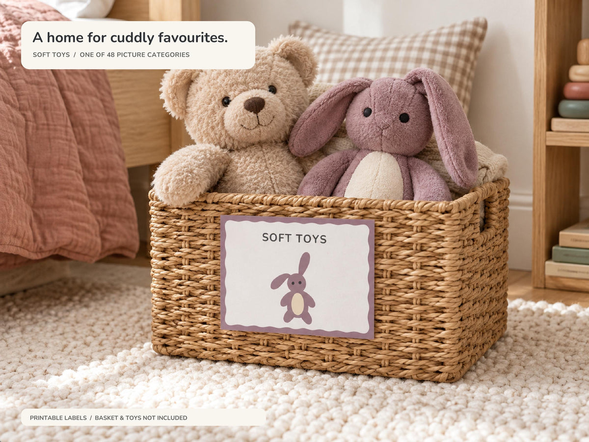 A teddy bear and mauve bunny sit in a woven basket labelled SOFT TOYS, beside a clay quilt and gingham cushion. The label uses the included simple bunny illustration and mauve wavy frame.