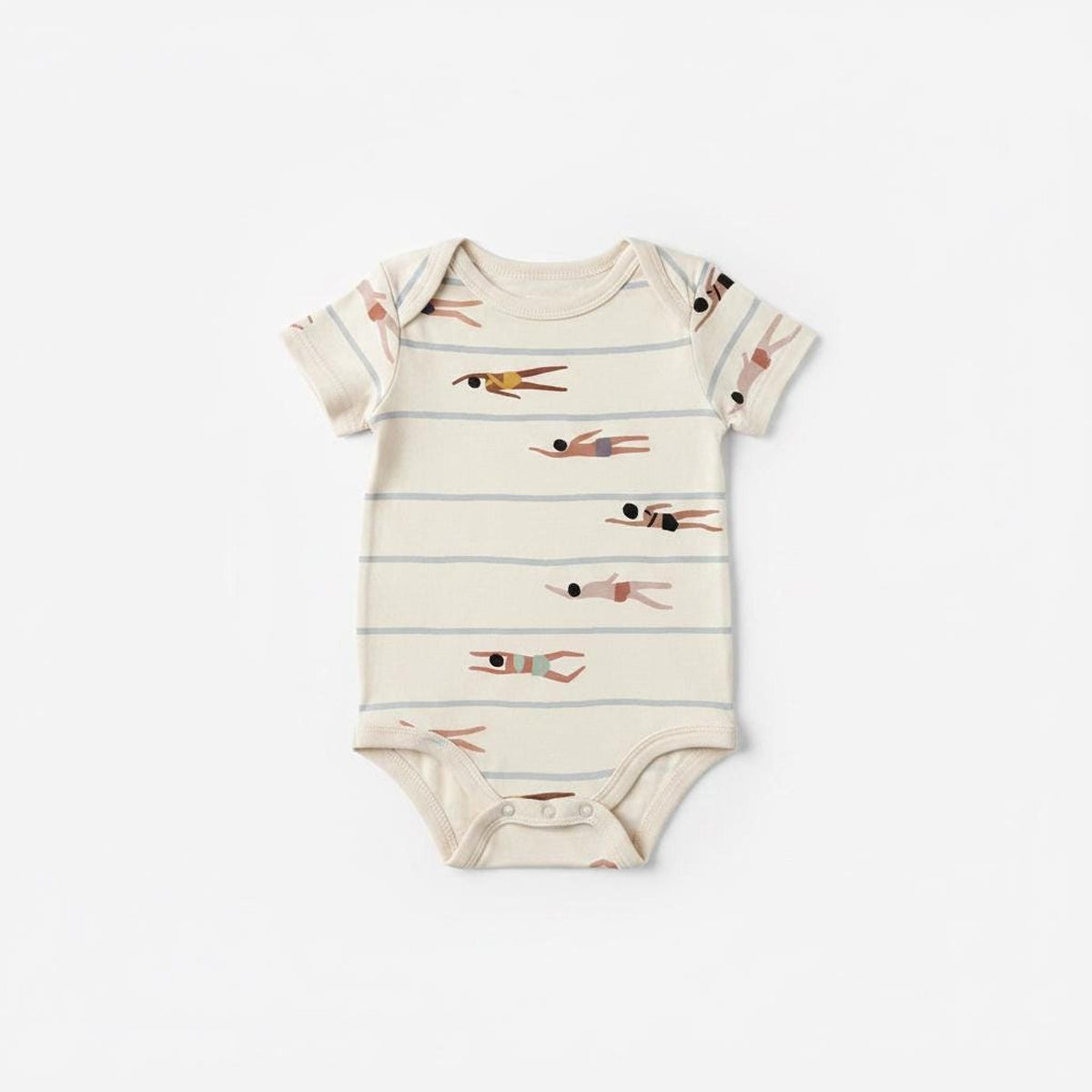 A baby onesie made from cream fabric printed with a repeating swimmer and stripe pattern.