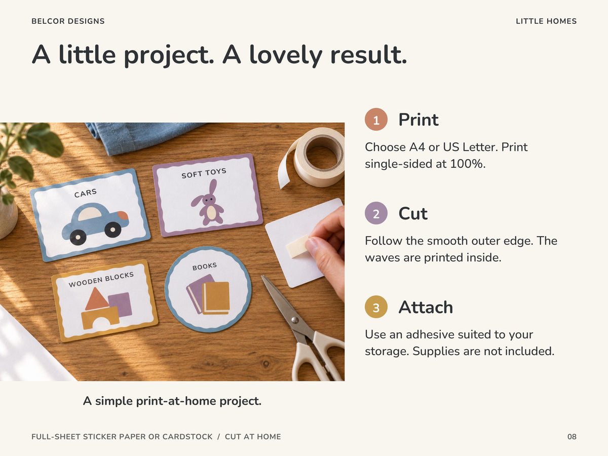 Cars, soft toys, wooden blocks and circular books labels on a wooden table beside scissors and tape. An adult hand applies tape to a label back. Print, cut the smooth outside edge and attach.