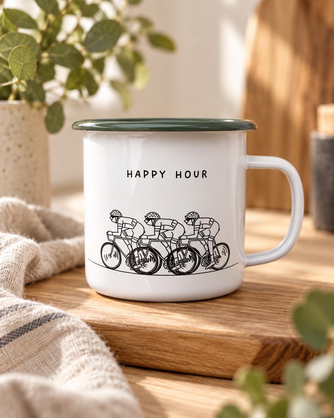 A white enamel mug with a dark green rim and a handle. The front features a black line drawing of three cyclists riding in a row, positioned below the black text "HAPPY HOUR" printed in a simple, sans-serif font on the mug surface.