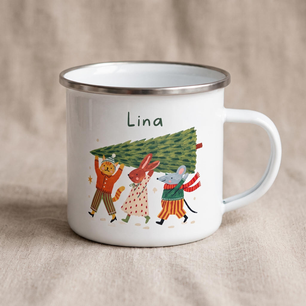 A white enamel mug with a silver rim featuring a whimsical illustration of a cat, rabbit, and mouse carrying a Christmas tree, with the name Lina printed above.