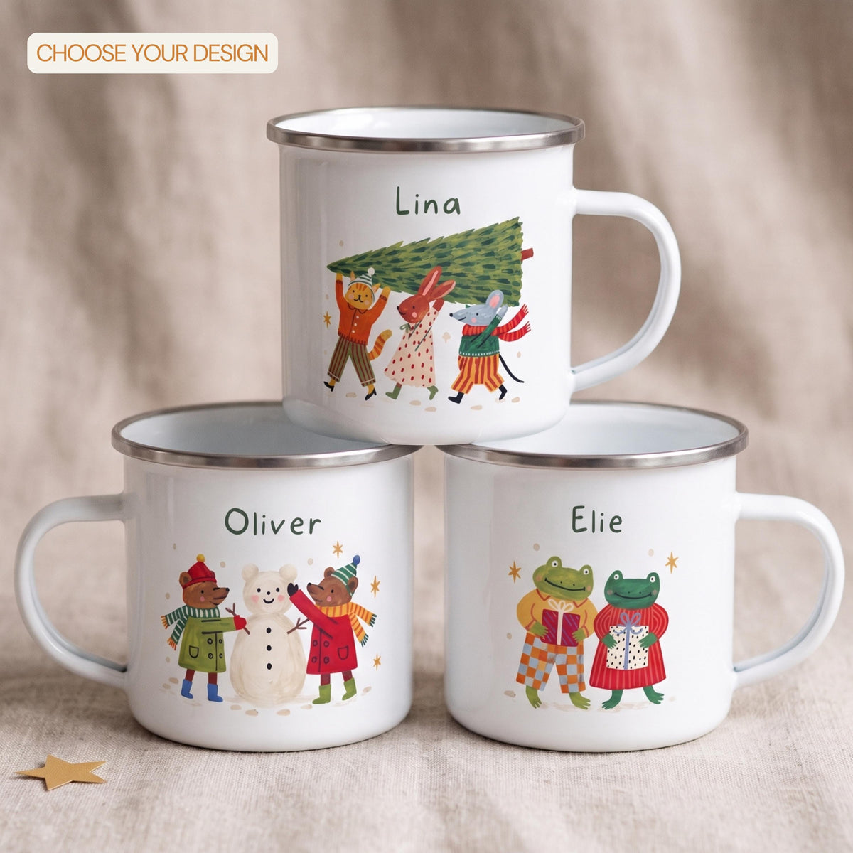 Three white enamel mugs with silver rims stacked against a fabric background, each labeled with a different name and animal holiday illustration, with a badge reading choose your design in the upper left.