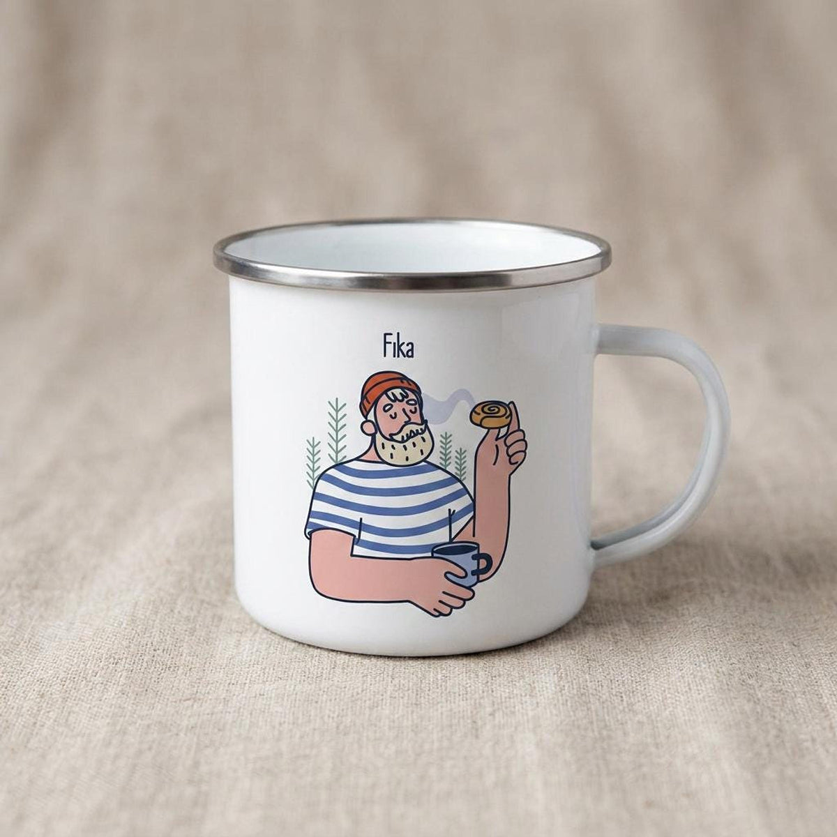 A white enamel camping mug featuring an illustration of a bearded man in a striped shirt holding a cup and a pastry, with the text Fika above him.