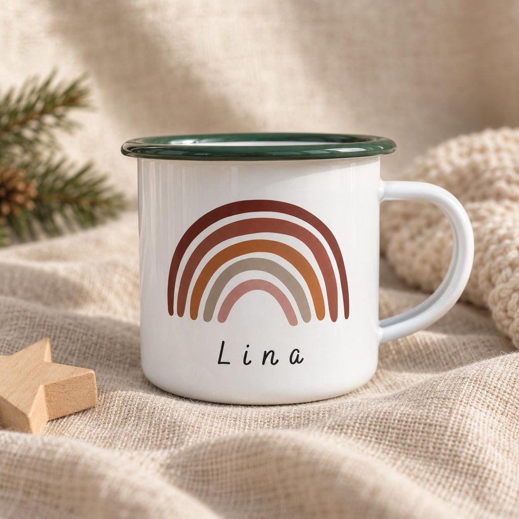 A white enamel mug with a dark green rim and a handle. The front features a graphic of a multi-coloured rainbow in shades of brown, rust, and pink. Below the rainbow, the name Lina is printed in a simple, black, sans-serif font.