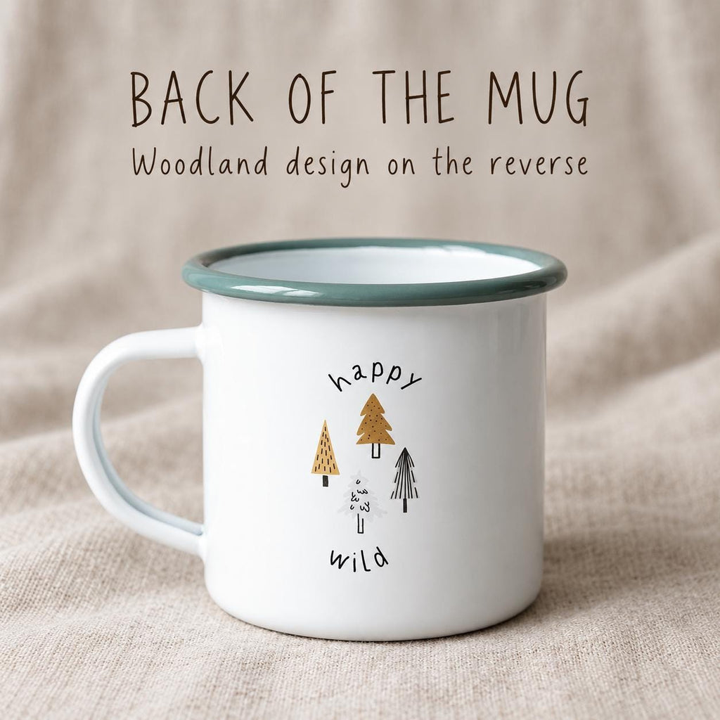 Back of the mug: the woodland design on the reverse, with small trees and the words happy and wild, on a white enamel mug with a green rim.