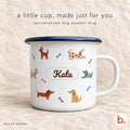 White enamel mug with a navy rim, printed with playful dogs, bones and the name Kate in a stitched-style label.